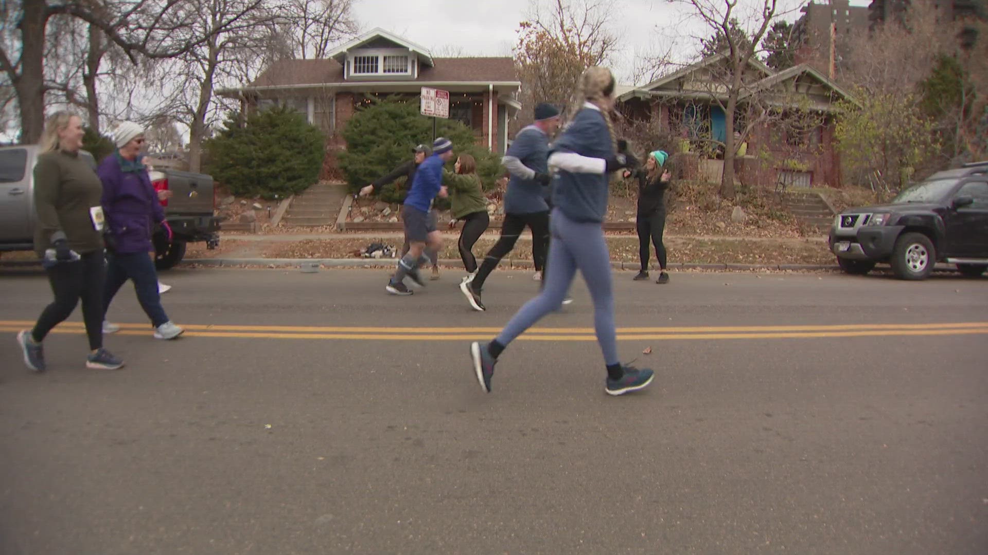 Thousands run at Wash Park every year before gorging their meals. Dozens of neighbors come out to provide support -- and some libations.